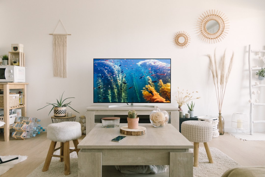 Close-up of a flat-screen TV panel showing subtle anti-glare coating in a softly lit living room.